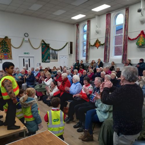 Reception children sing to the U3A community